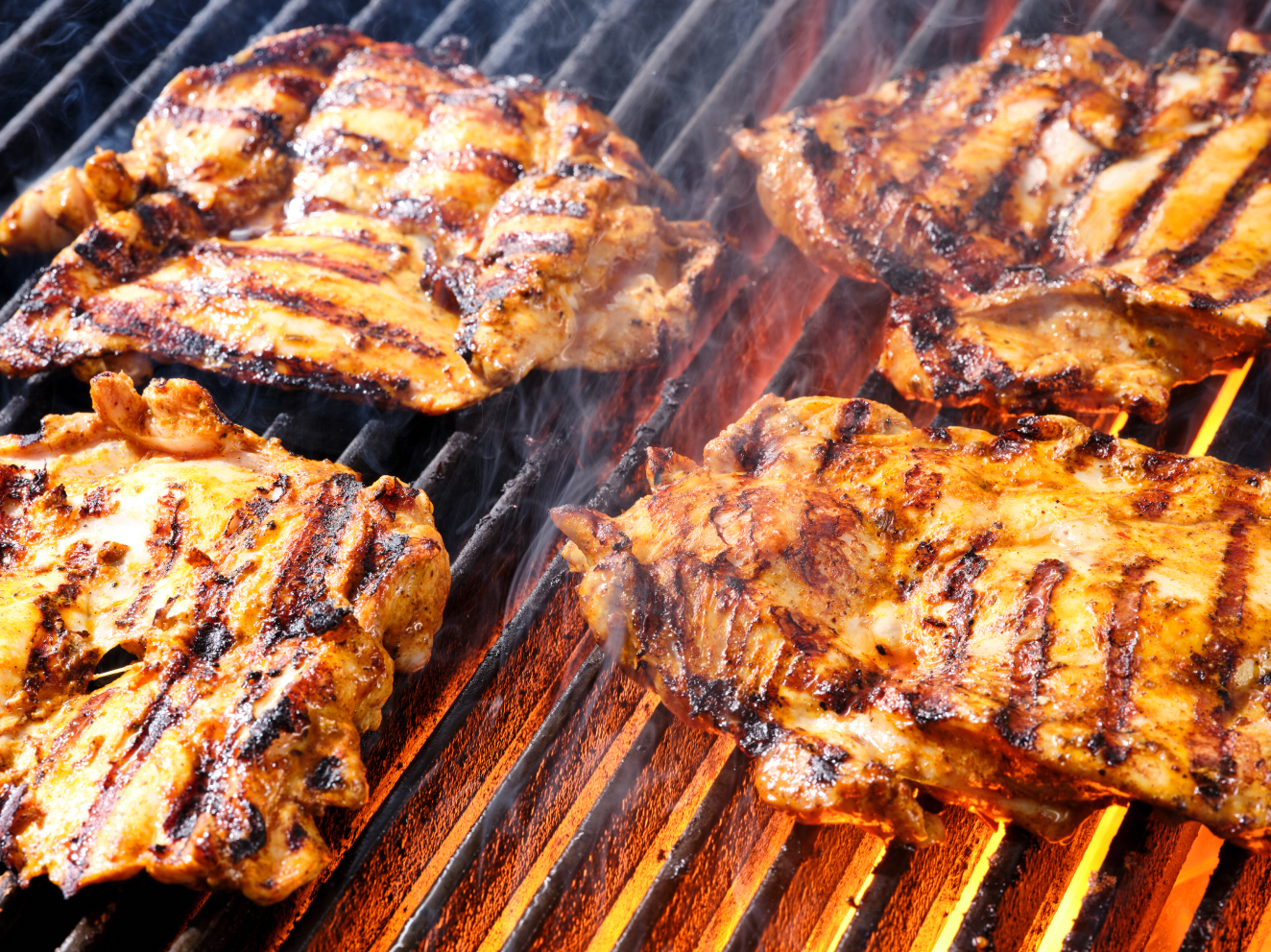 Chicken cooking on the grill at Guzman y Gomez>